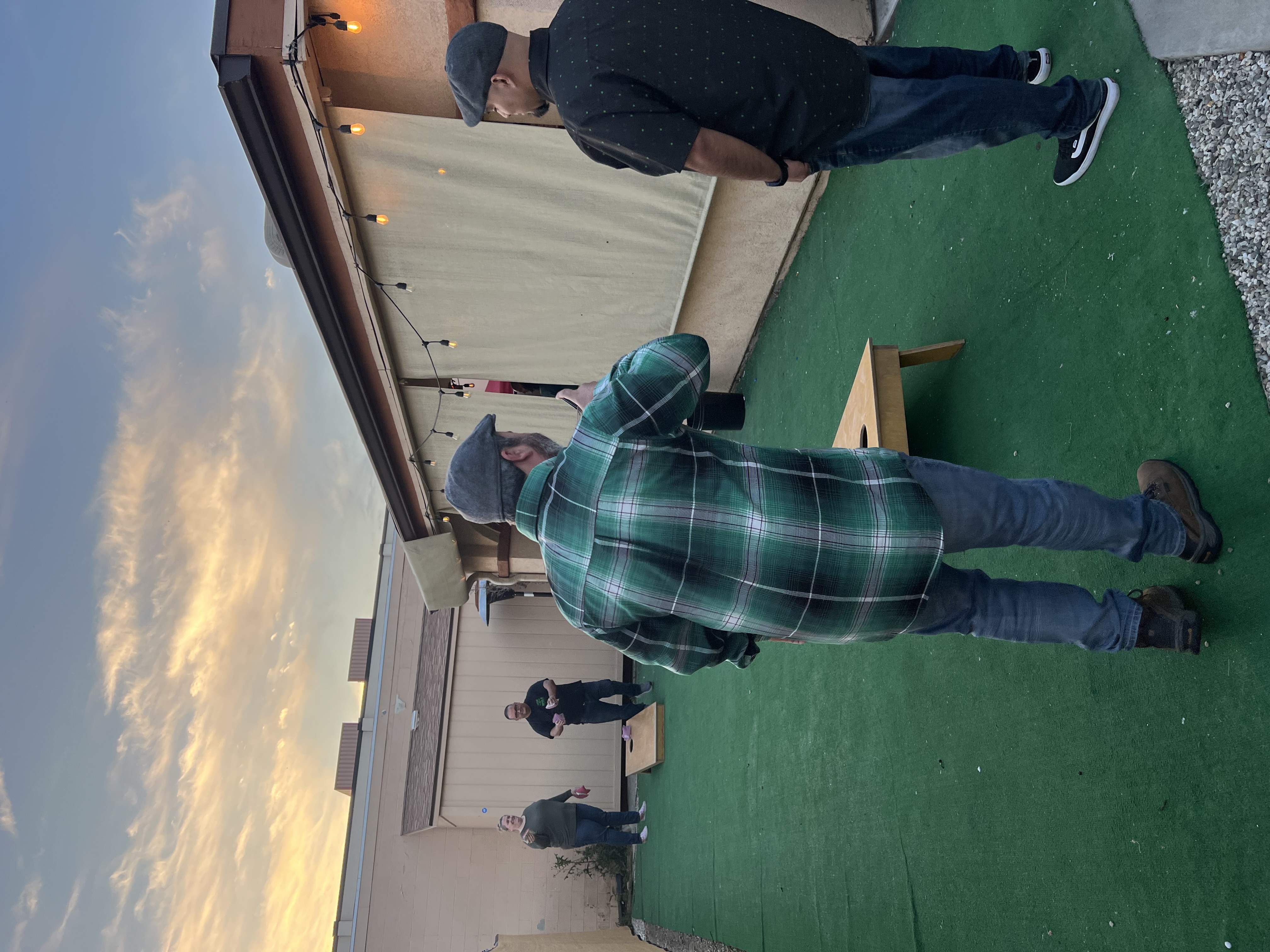people playing cornhole