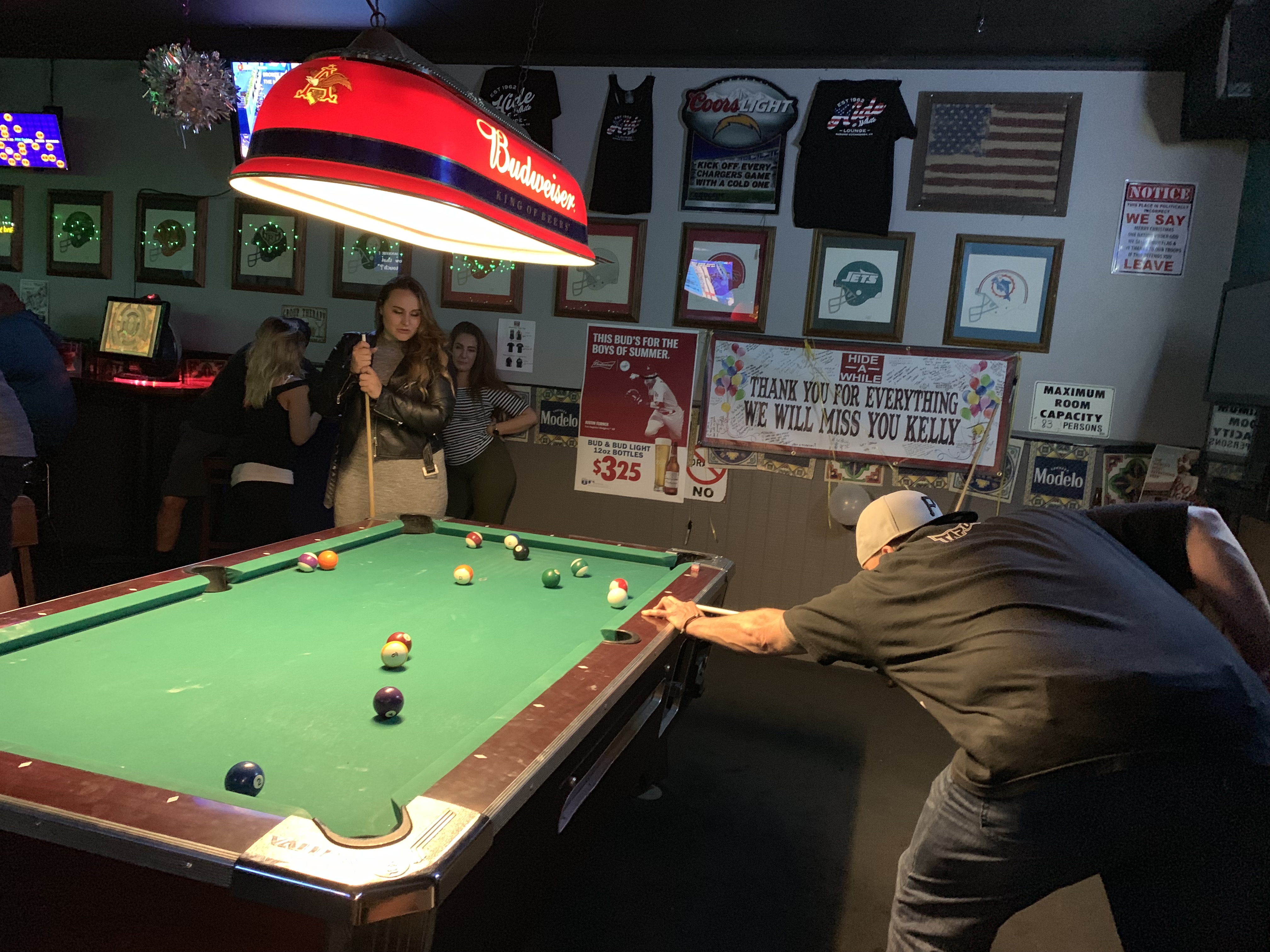 two people enjoying a game of pool