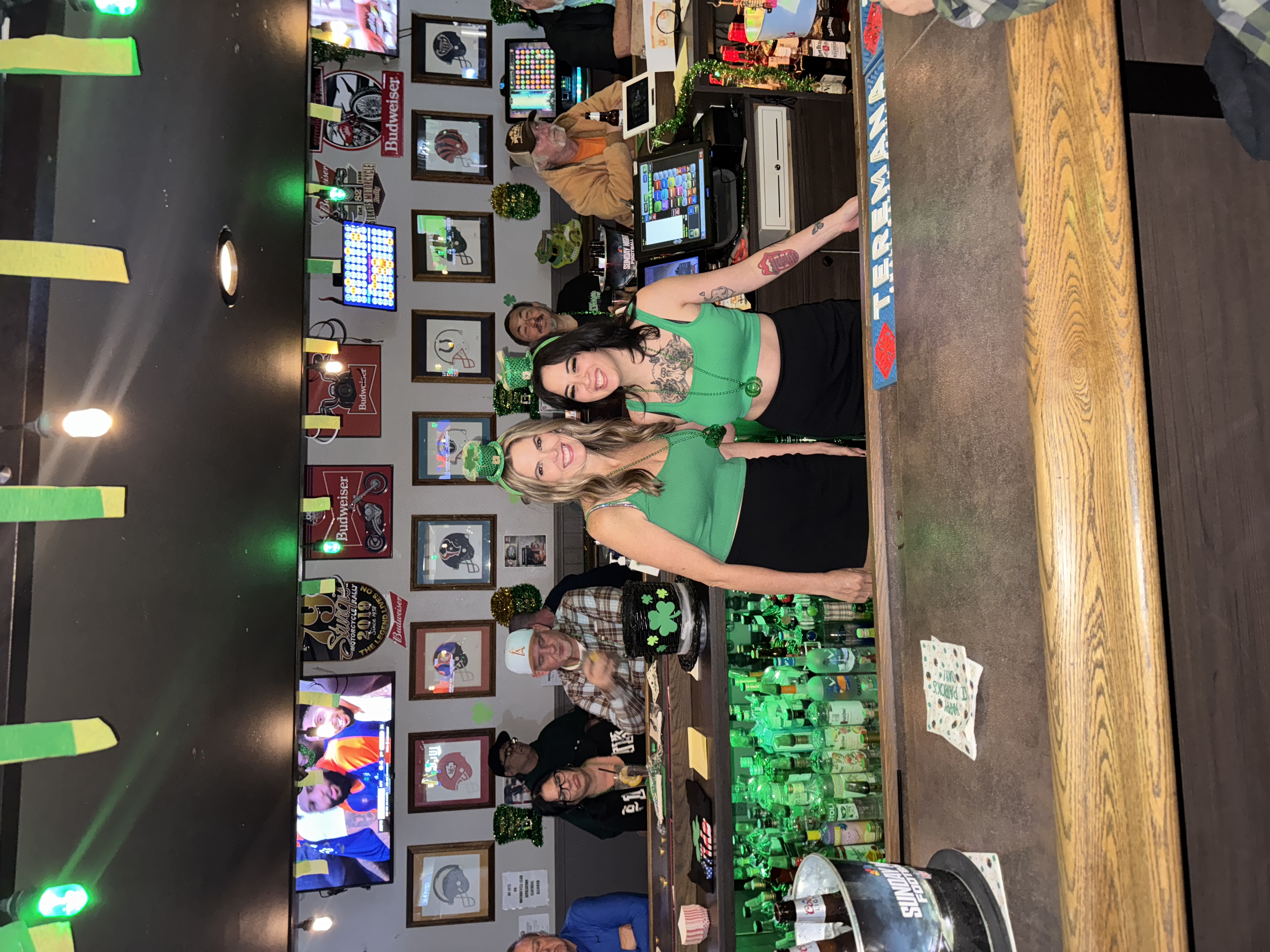 picture of two bartenders with saint patrick's day attire