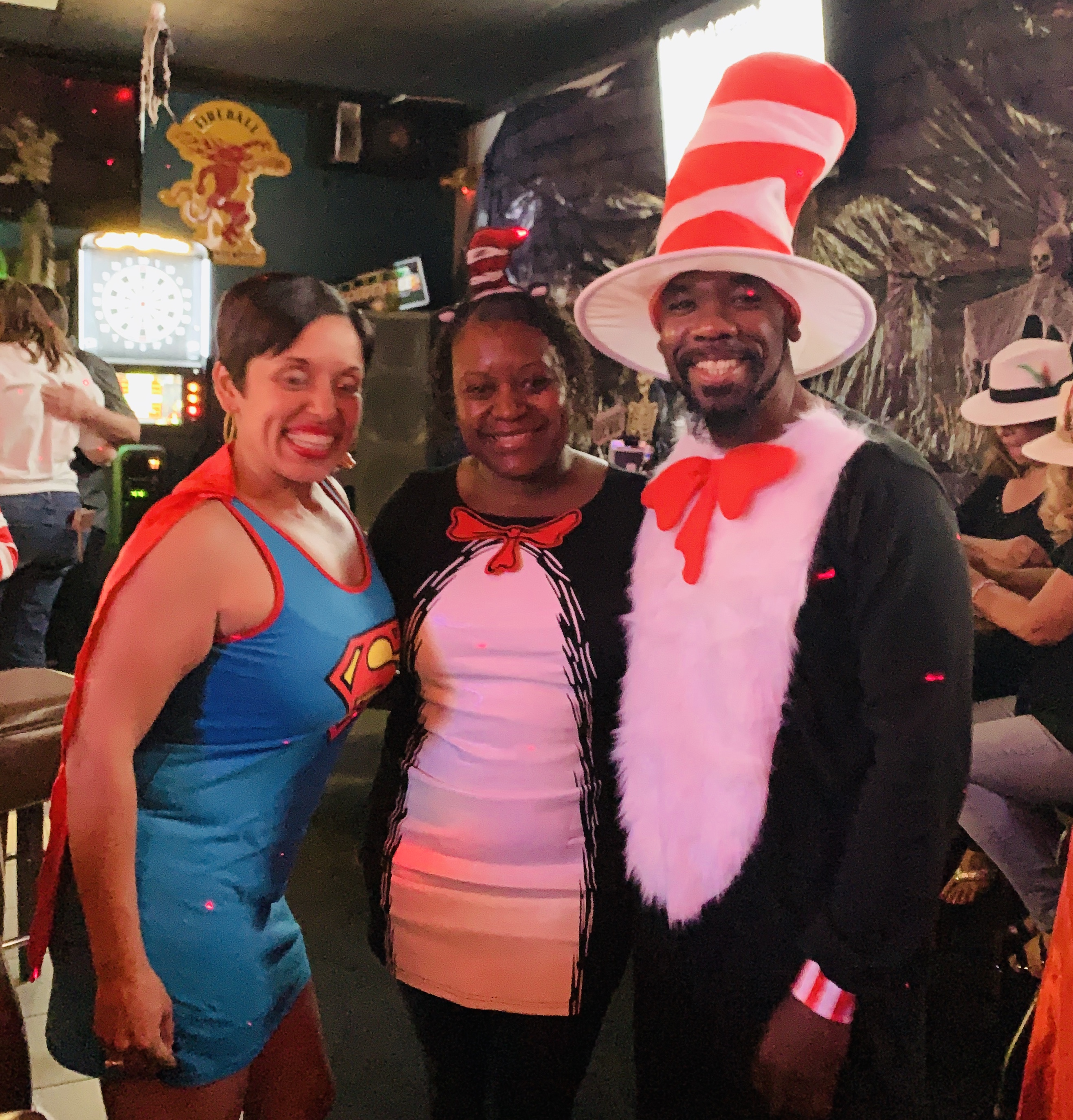 people dressed up as superman, and cat in the hat